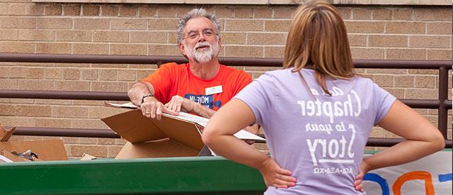 faculty checking student in to dorm  